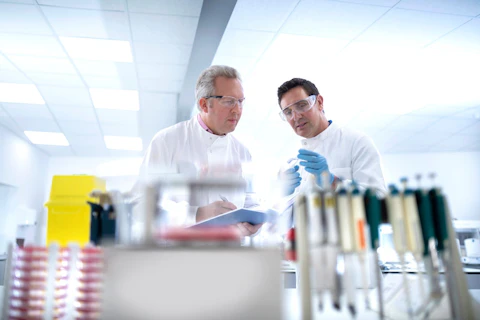 Scientists Discussing Test Results in Laboratory